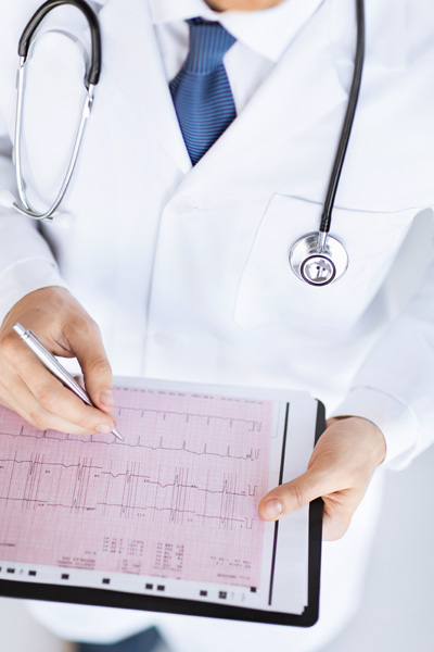 Doctor looking over a patient's medical diagnosis for errors.